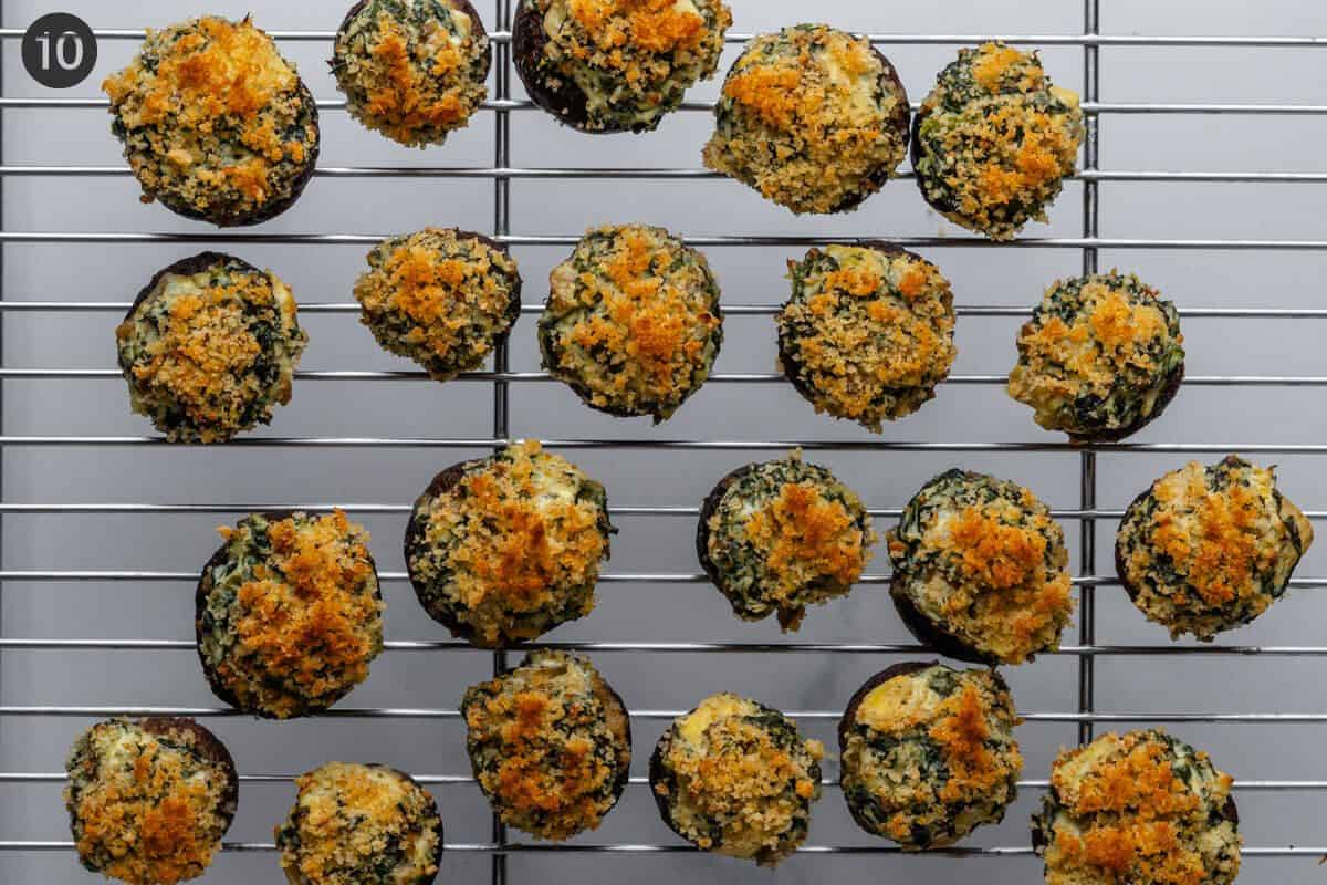 Cooked stuffed mushrooms on a cooling rack