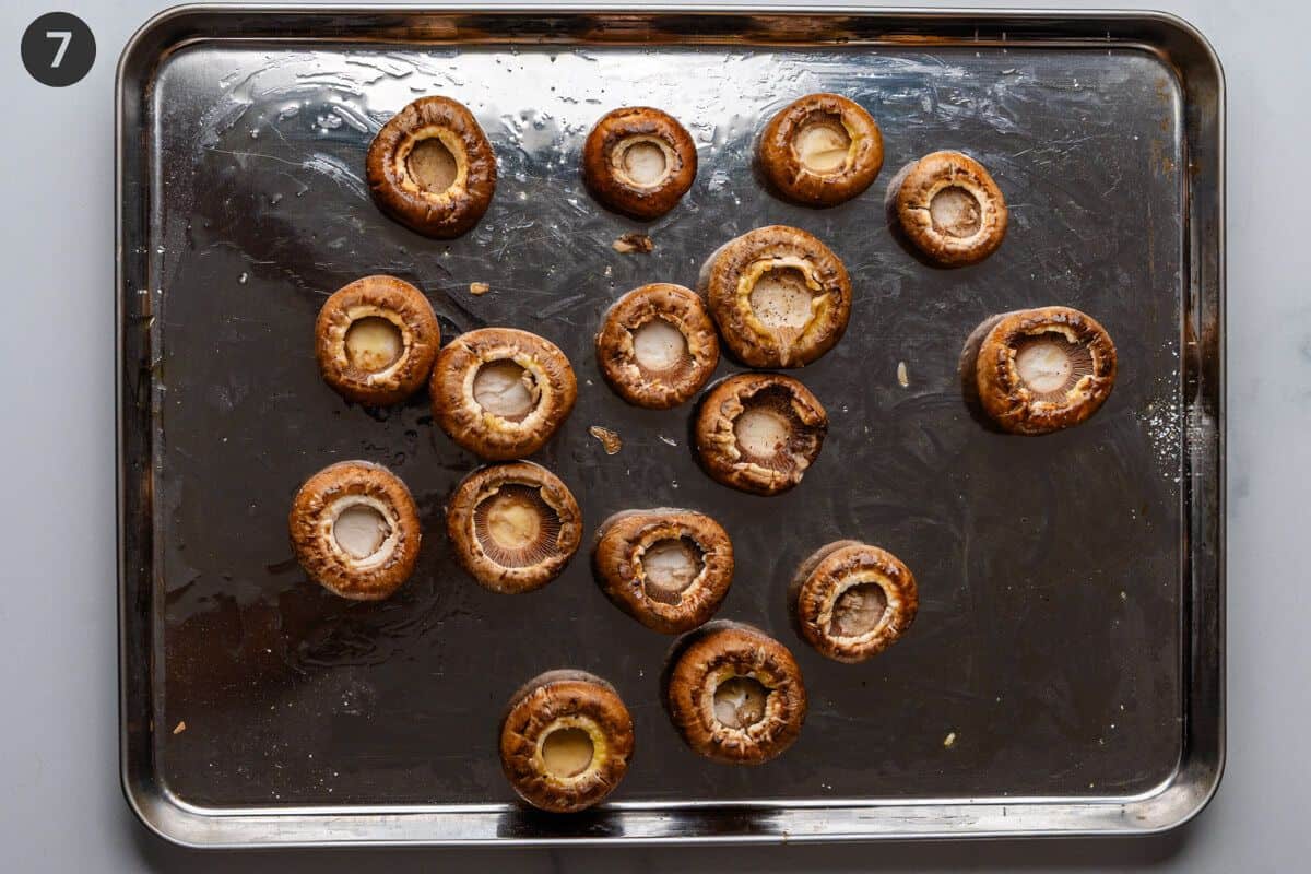 Mushrooms on a baking sheet with olive oil