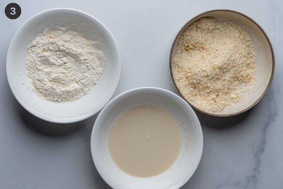 Dipping station bowls of flour, wet batter and panko