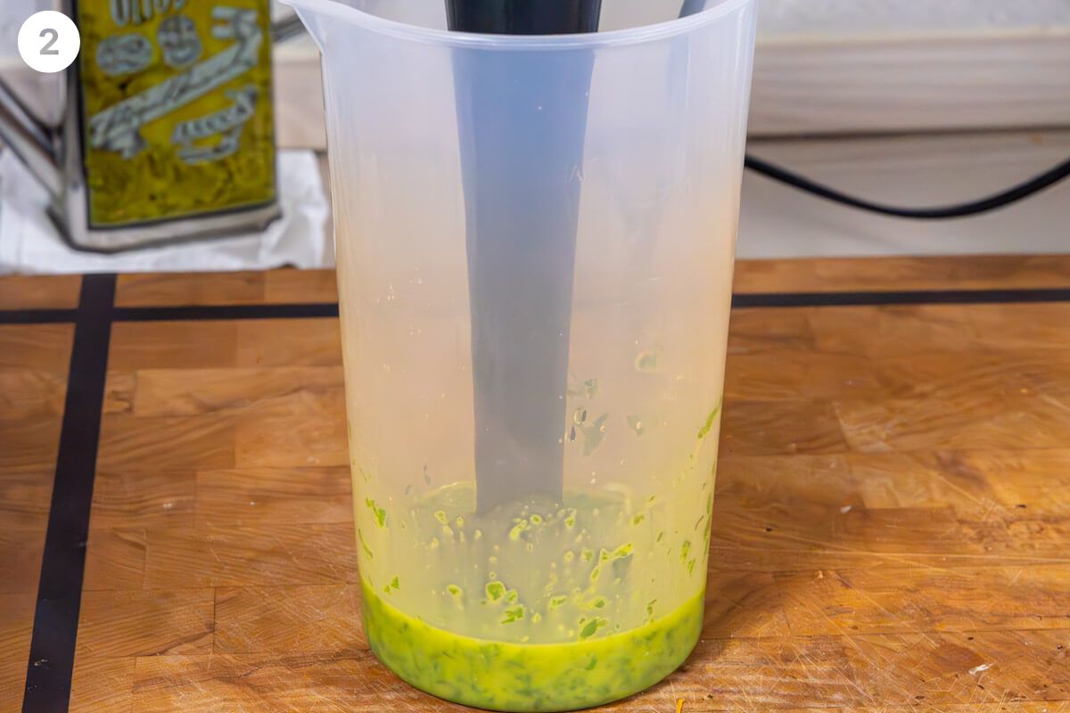 Oil being blended with basil