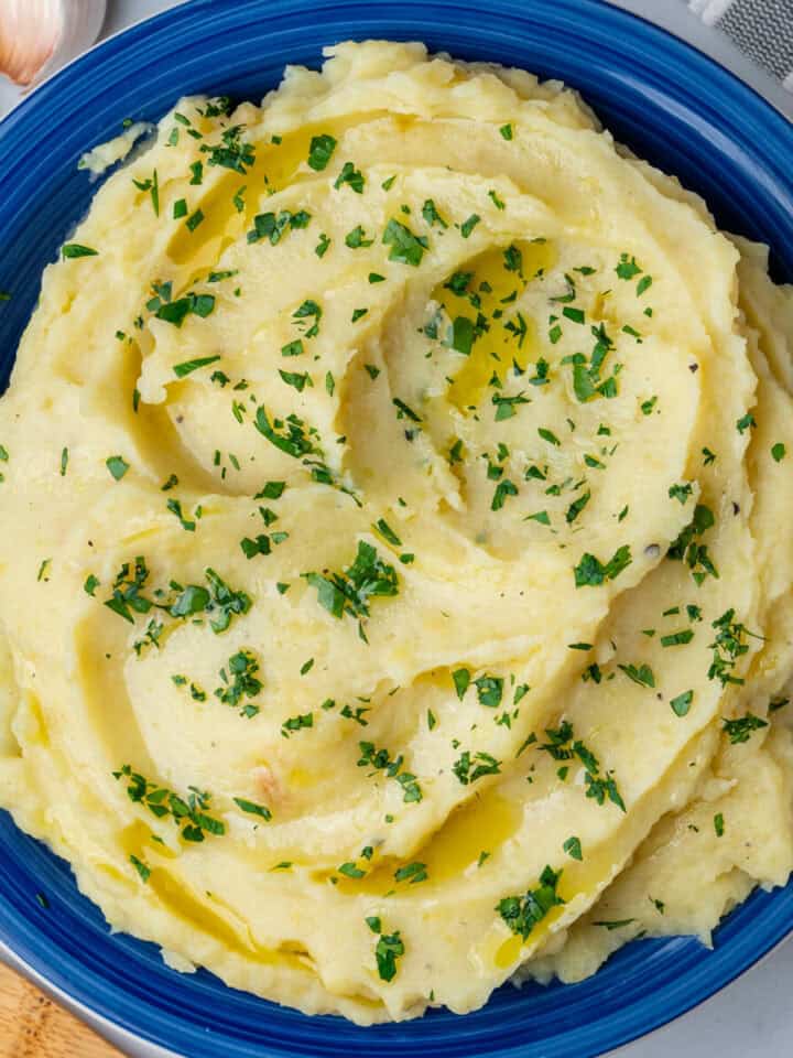 Garlic roasted mashed potatoes in a bowl with parsley