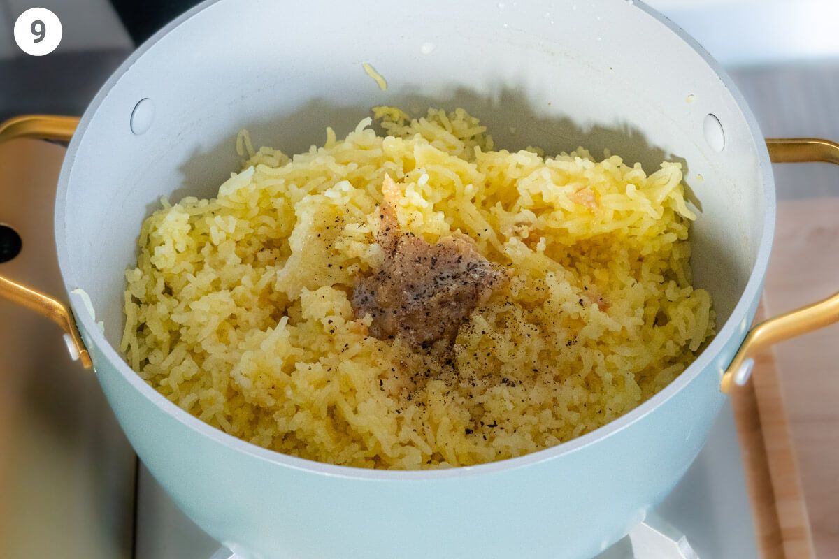 Garlic, milk and seasoning added pot of mashed potatoes