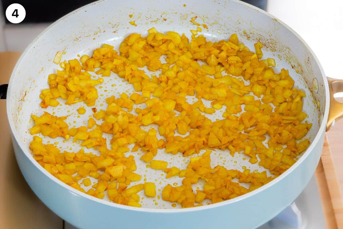 Onions fried with turmeric in a pan