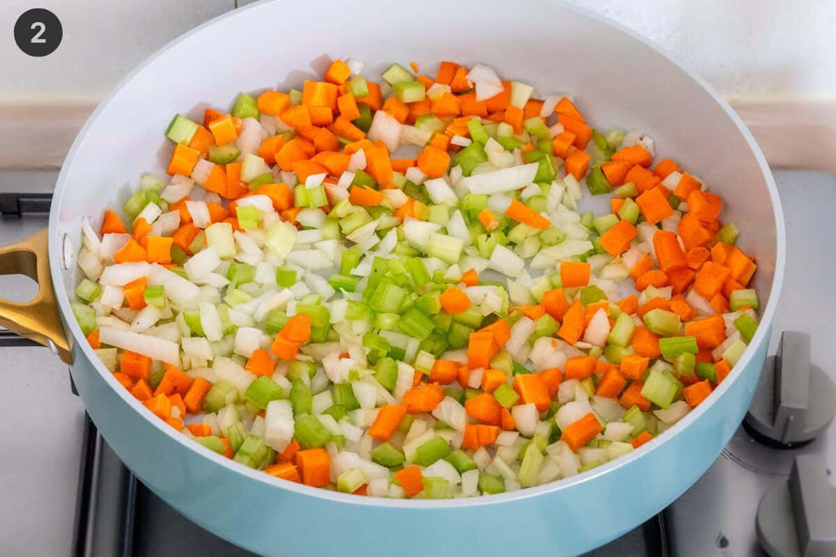 Vegetables being sautéed on a fry pan