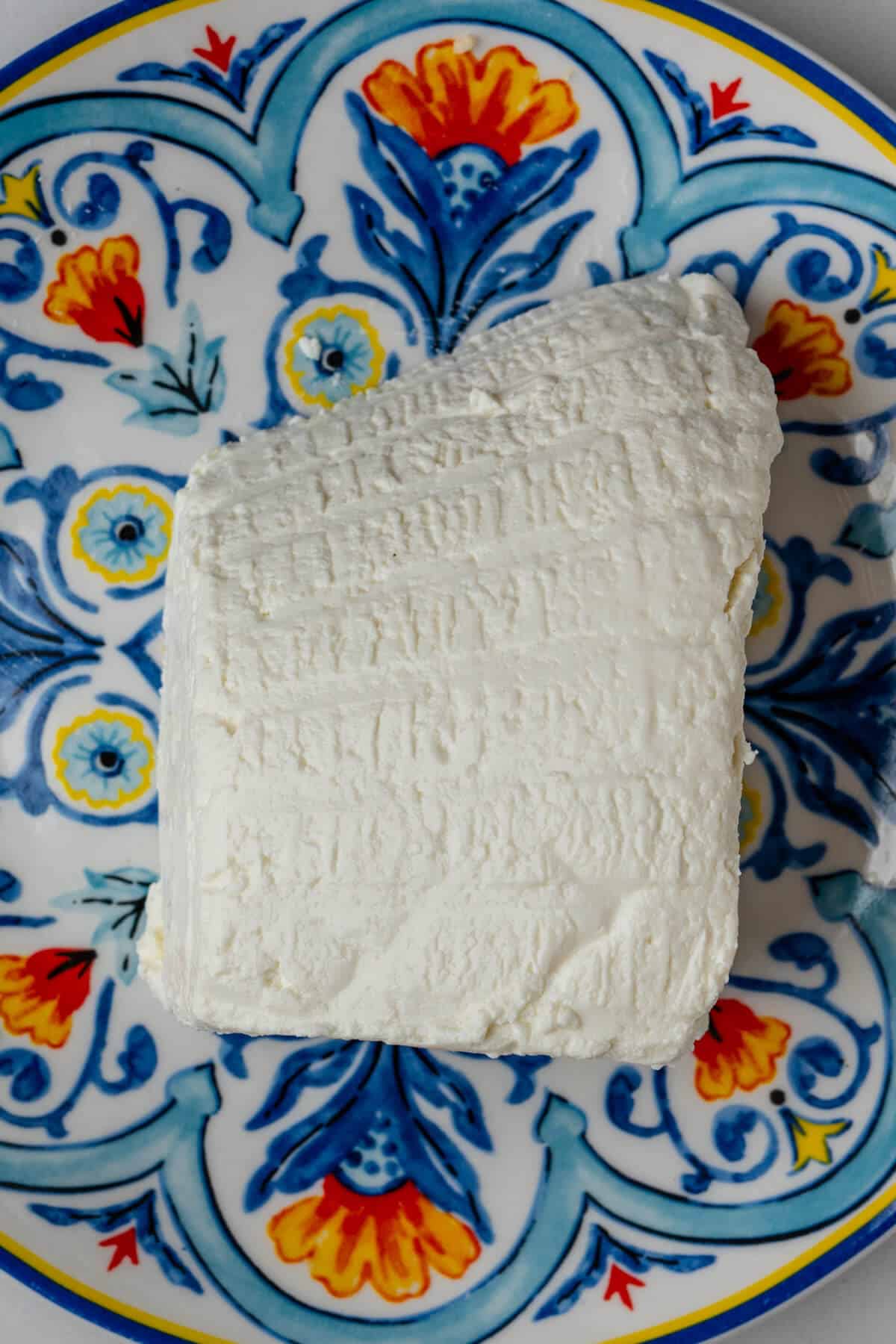 Large piece of fresh ricotta on a plate