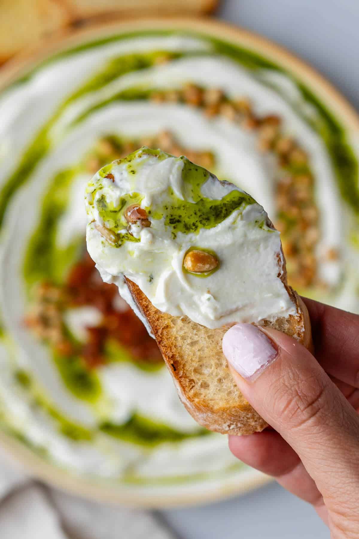 Close up of piece of bread with ricotta