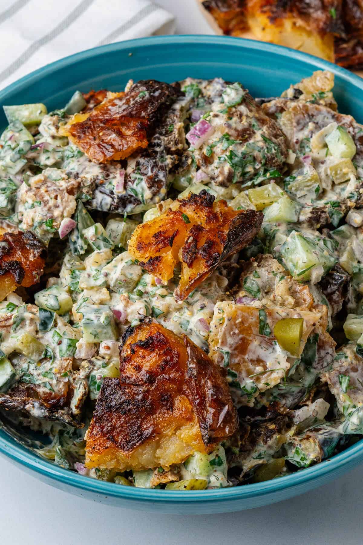 Smashed potato salad in a bowl