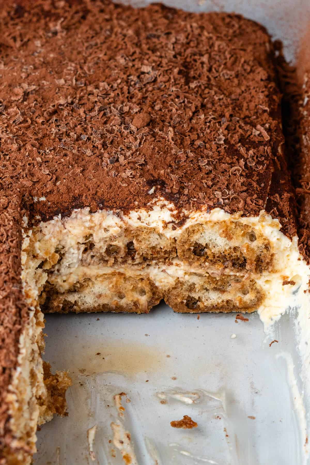 Inside look of tiramisu dish with piece missing