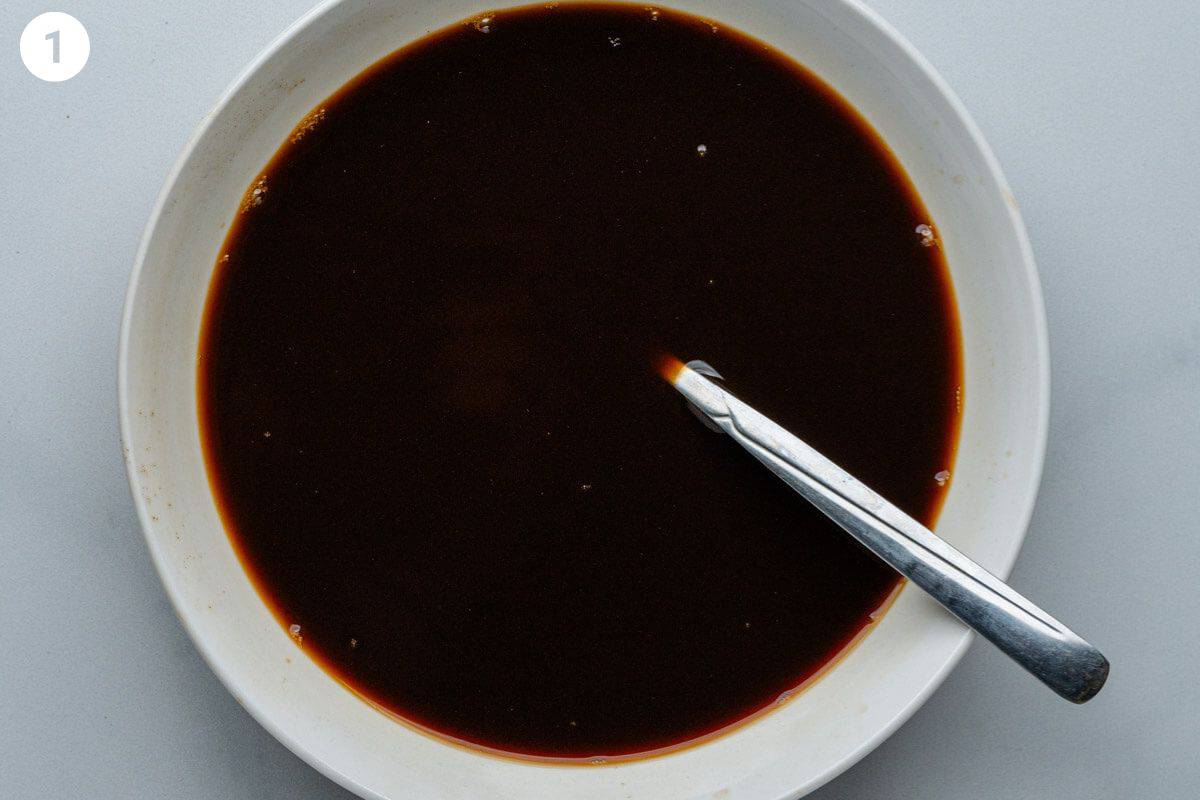 Coffee mixture in a deep bowl with a spoon