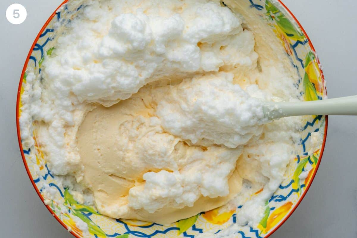 Egg whites being folded into cream