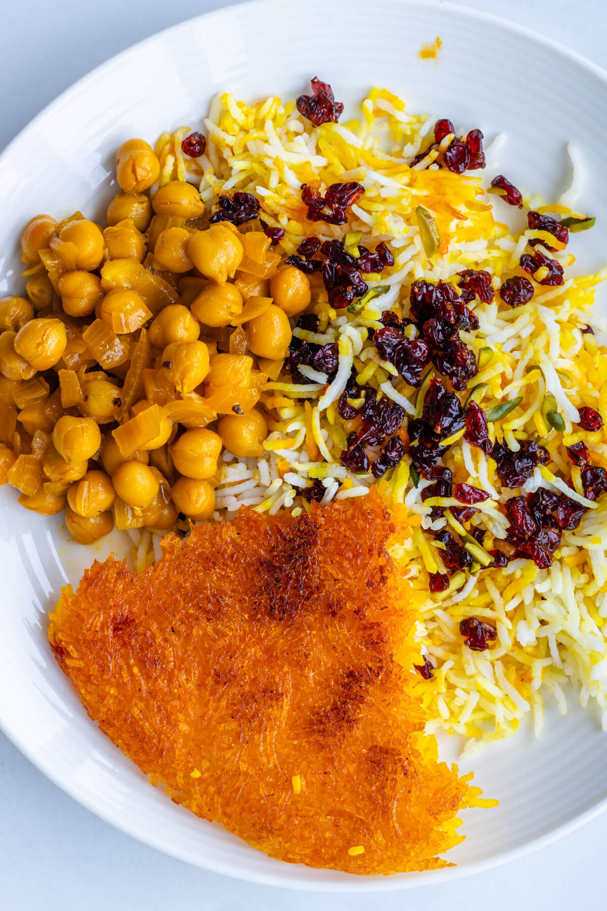 Chickpea stew served with tahdig and Persian rice