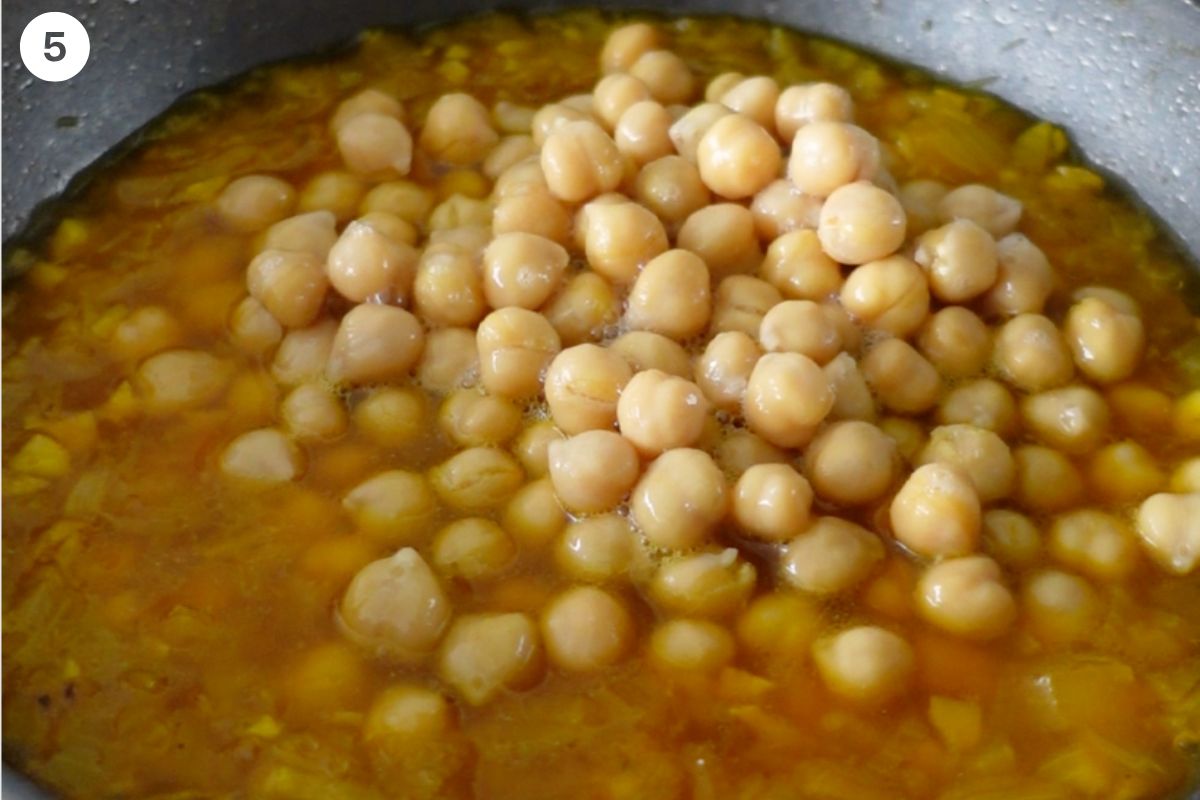 Chickpeas and saffron water added to pan