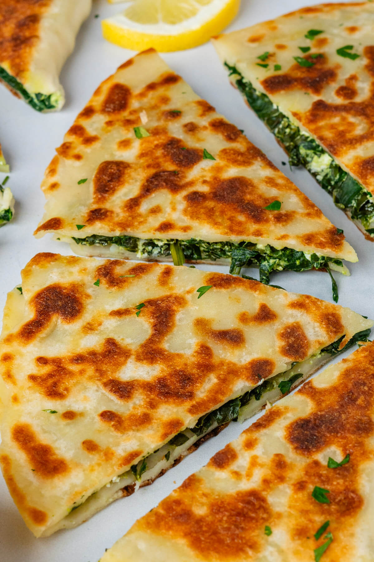 Pieces of Turkish gozleme filled with spinach and feta