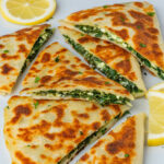 Gozleme with spinach and feta filling and lemon on the side