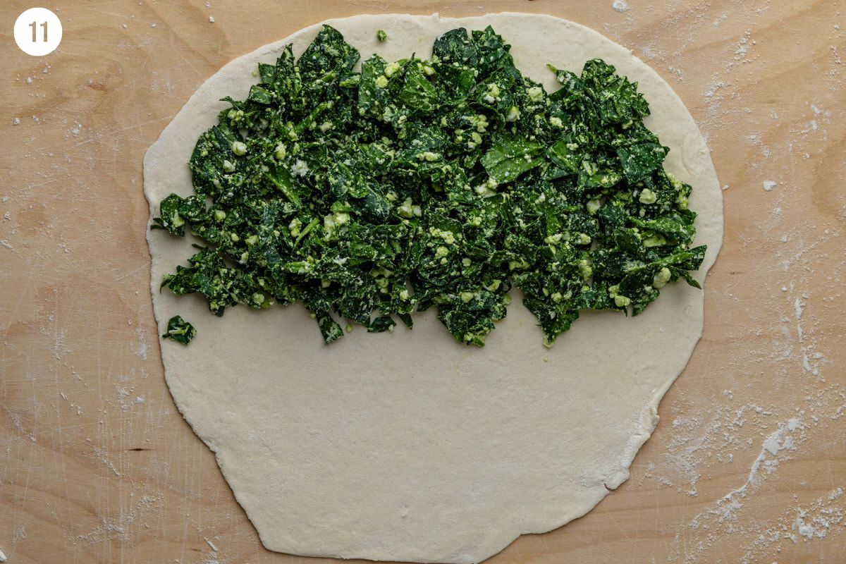 Spinach and feta filling added to one half of the dough