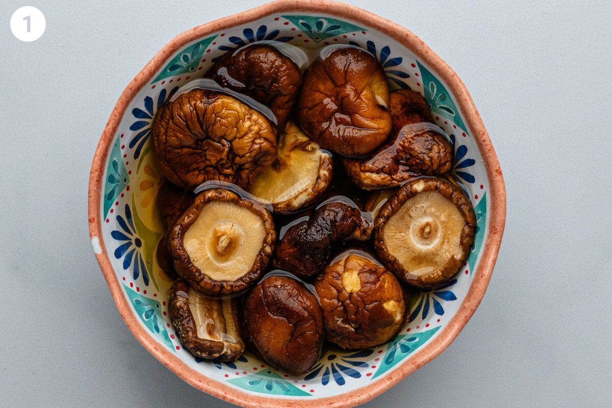 Shiitake mushrooms being soaked in water