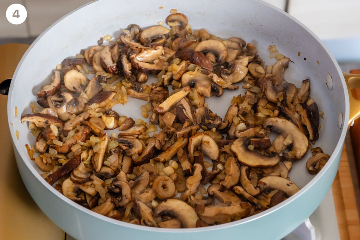 Mushrooms being sautéed with onions