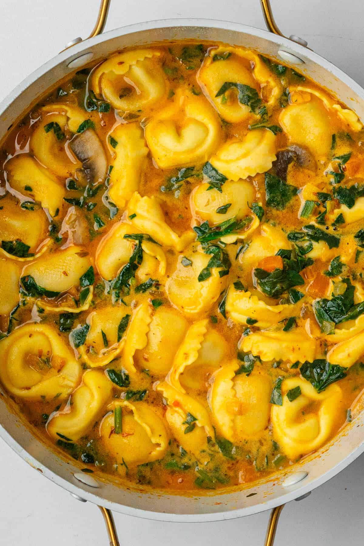 Tortellini soup in a large pot