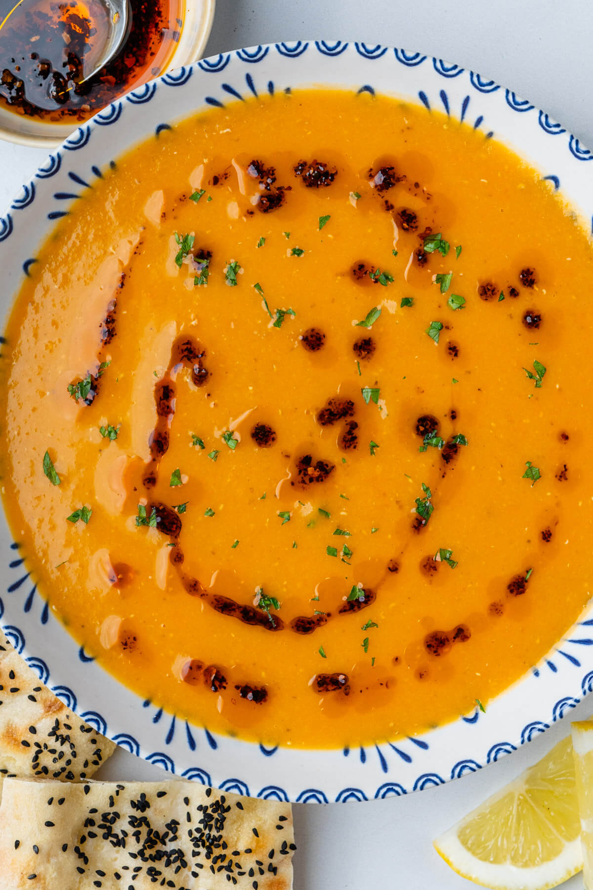 Turkish lentil soup (Mercimek Çorbası) with aleppo pepper, Turkish bread and lemon