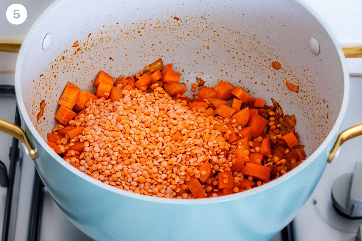 Red lentils and carrots added to the pot