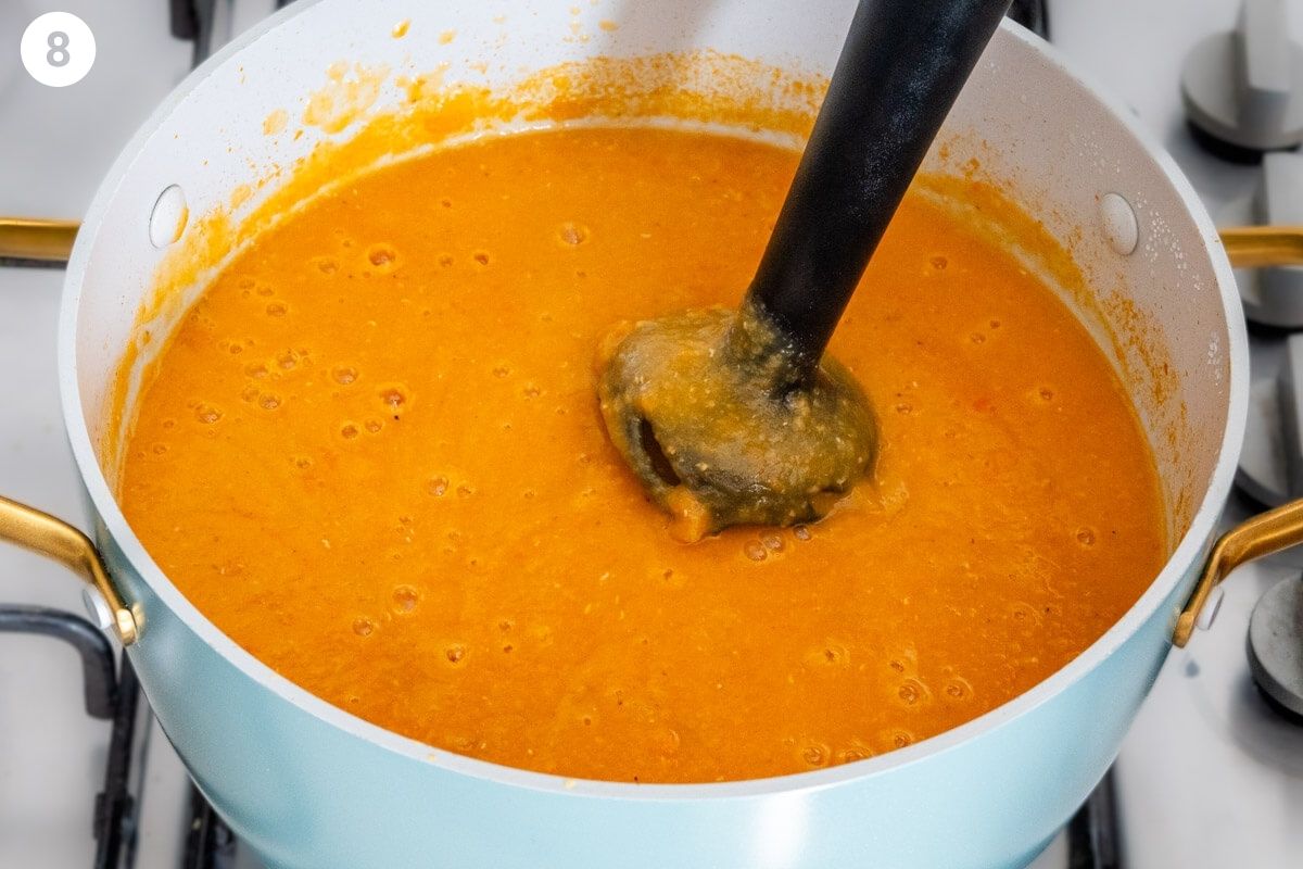 Blending the soup with a stick blended