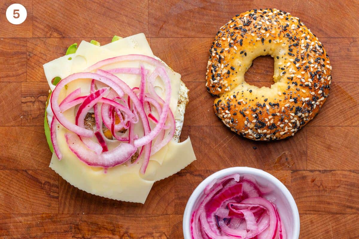 Pickled onions placed on top of cheese