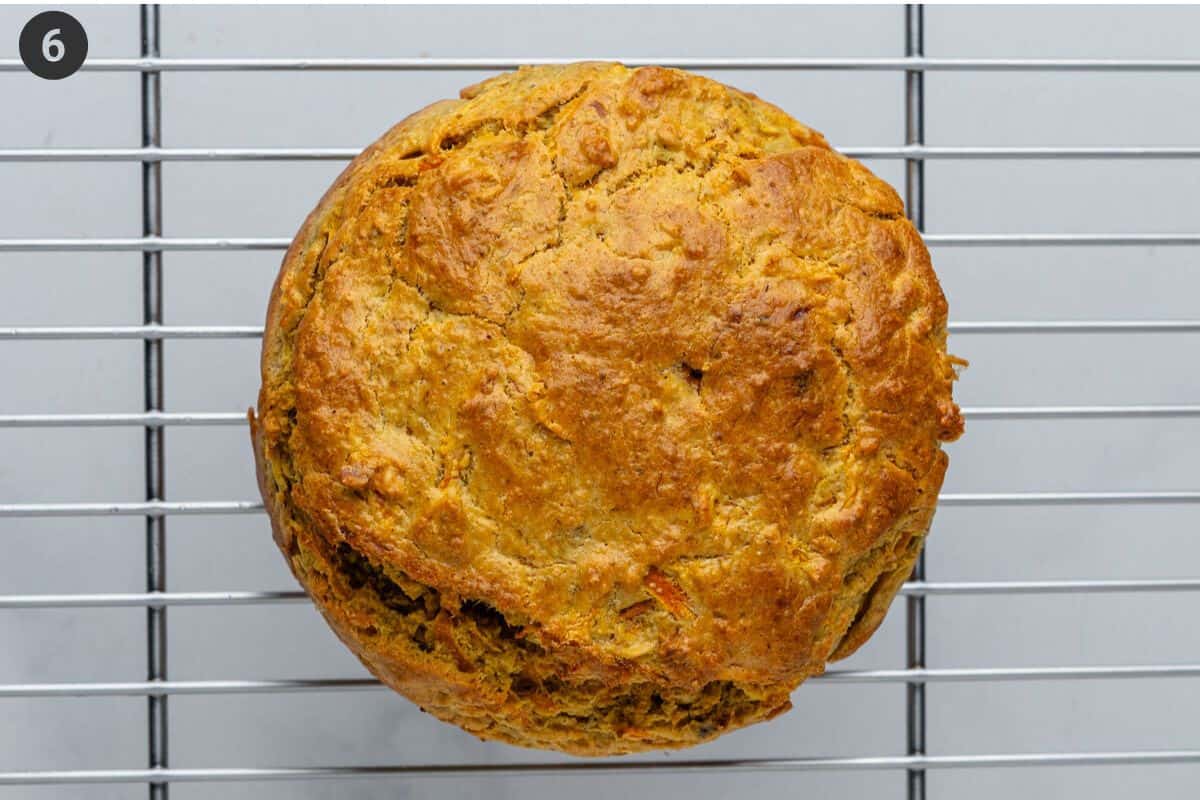 Cake resting on a cooling rack