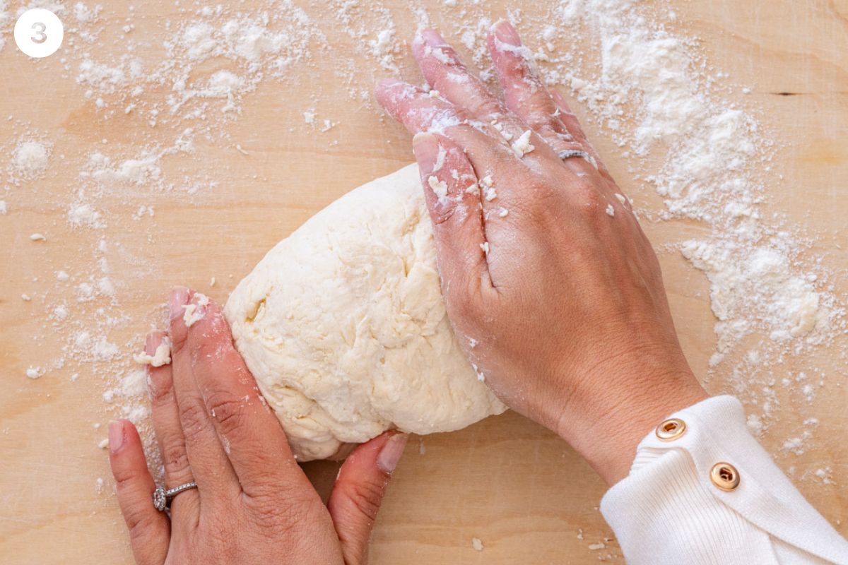 Kneading dough on a floured surface