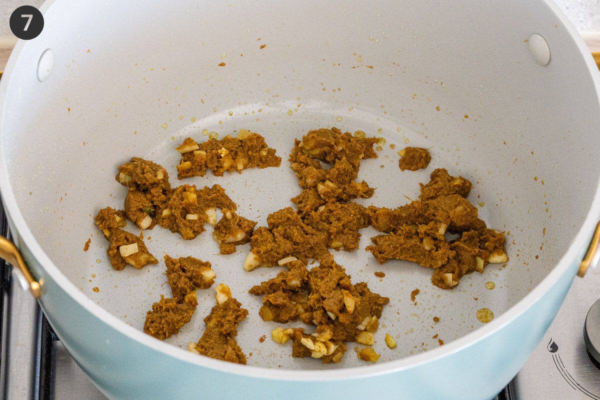 Curry paste being sautéed with garlic