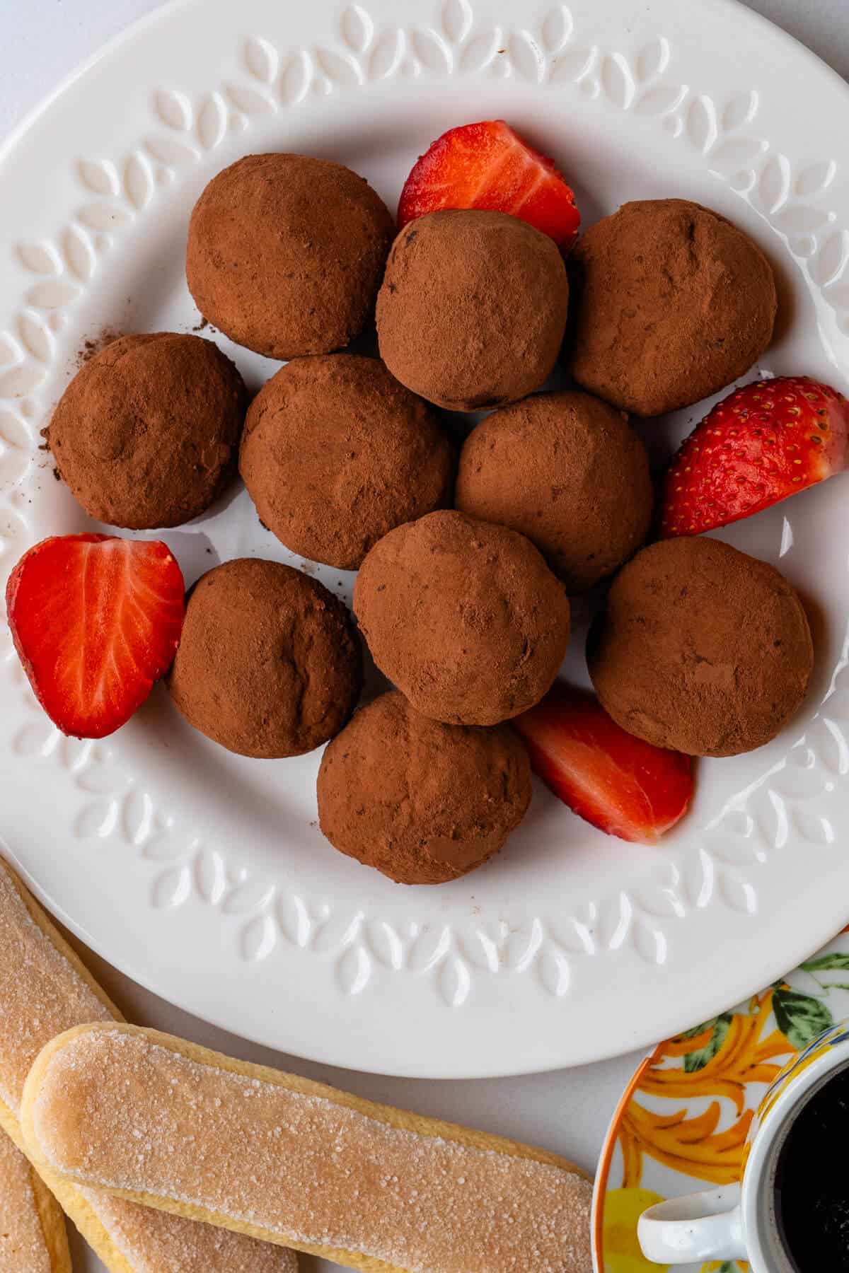 Truffles on a plate served with strawberries