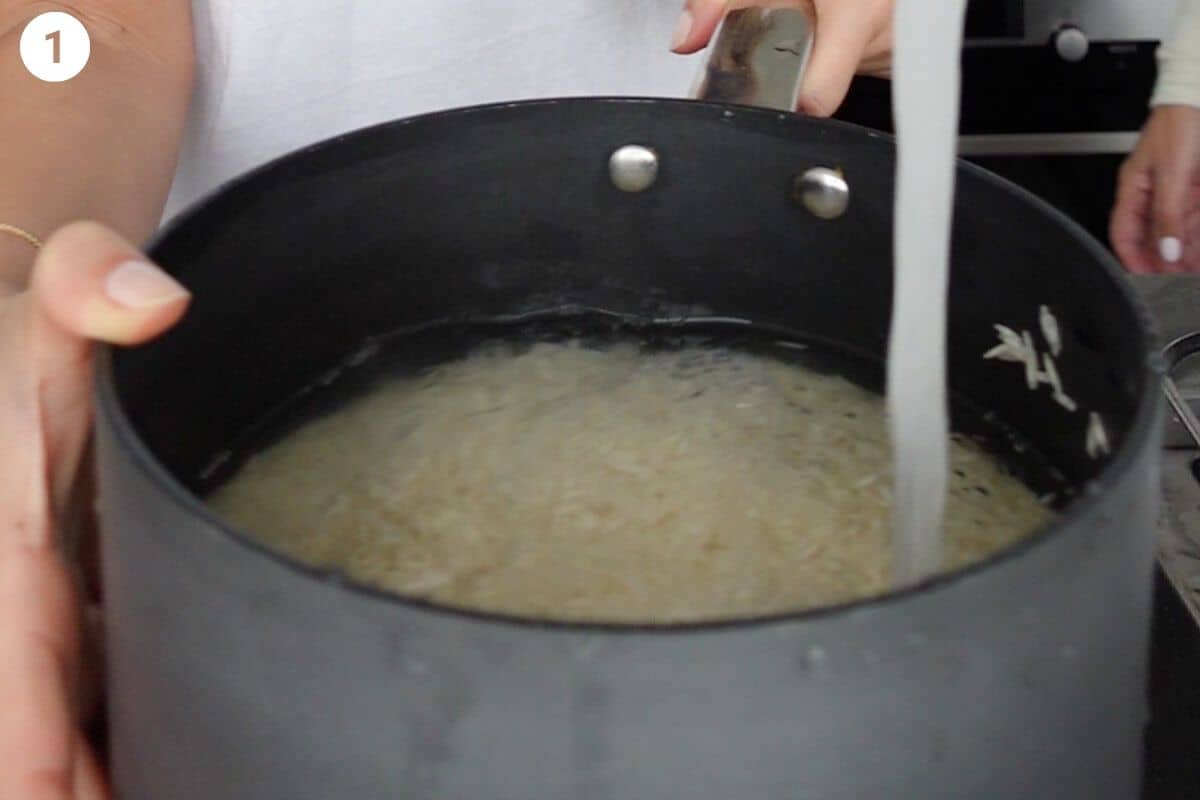 Basmati rice being washed in a pot with water