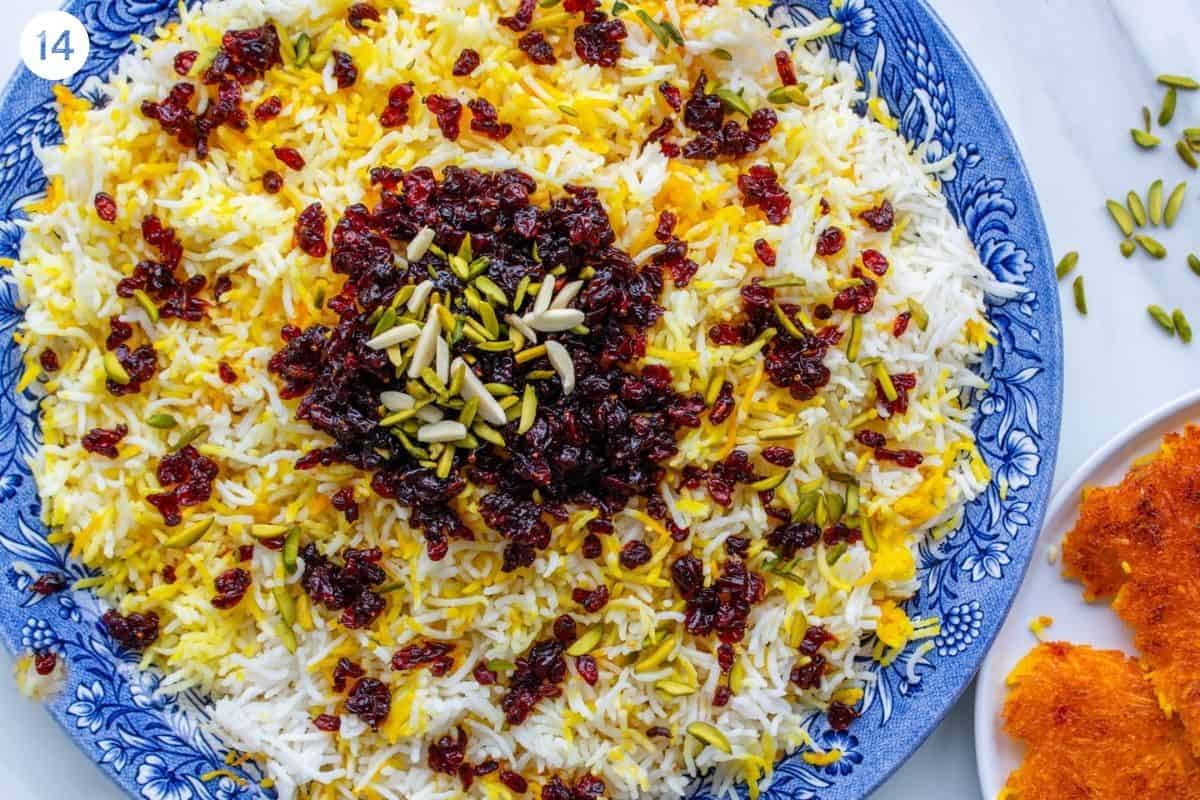 Final zereshk polo garnished with barberries, pistachios and almonds