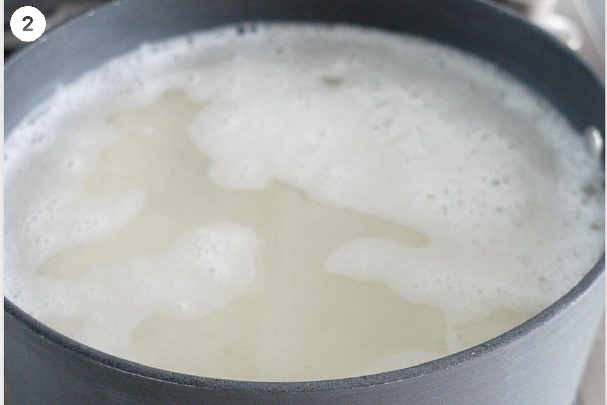 Water and salt added to pot with rice