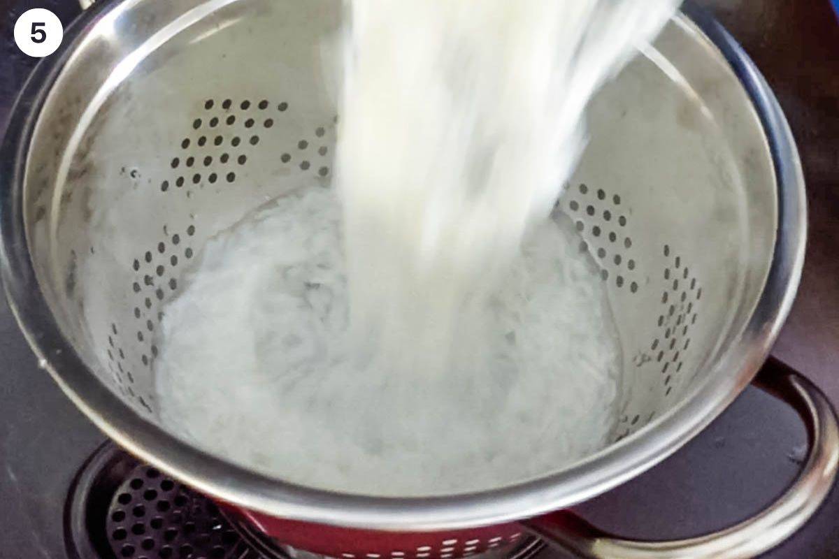 Par boiled rice drained in a colander