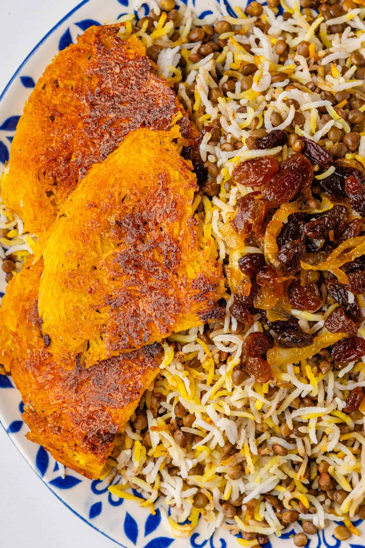 Tahdig on a plate with Persian lentil rice