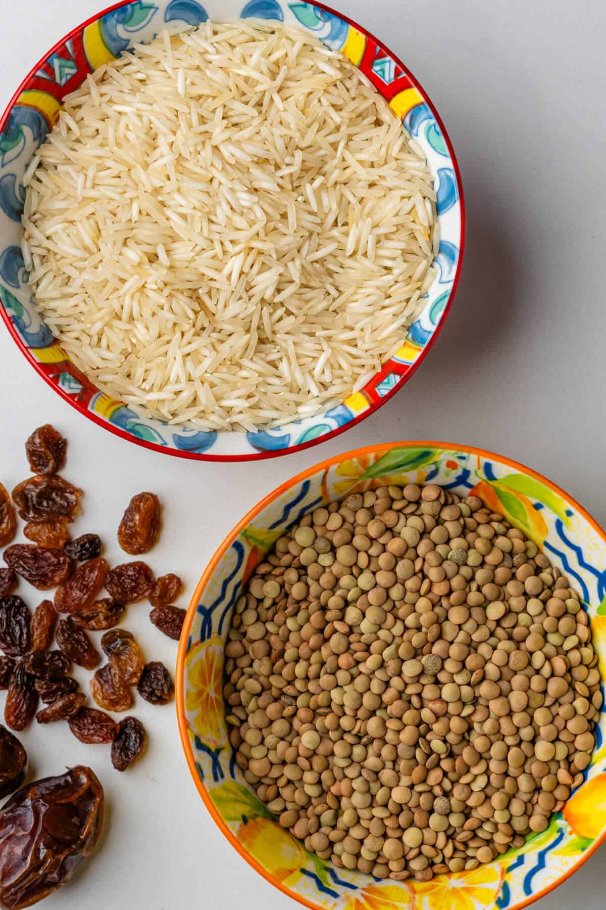 Ingredients to make Adas Polo, rice, lentils, sultanas and dates