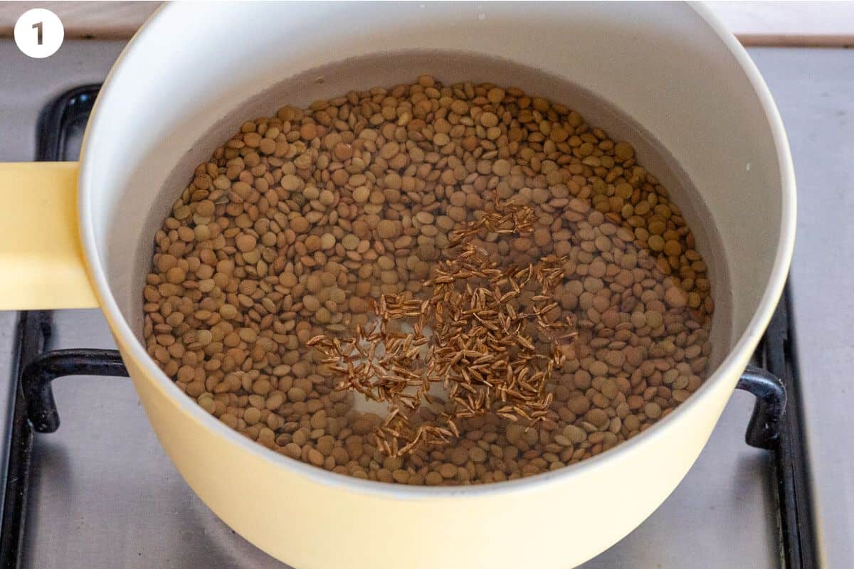 Lentils being cooked in a pot of water