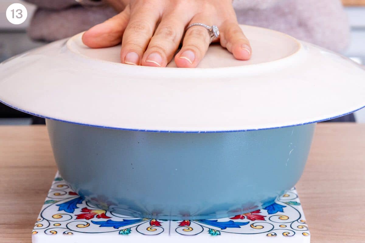 Plate placed on top of pot ready to turn it upside down