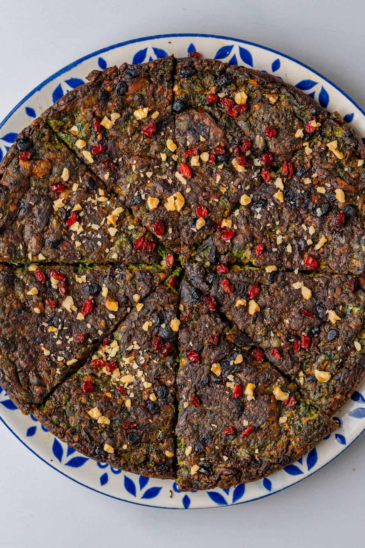 Kuku Sabzi Persian Herb Frittata sliced on a plate