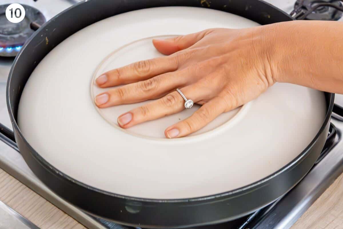 Plate placed on top of frittata to turn upside down