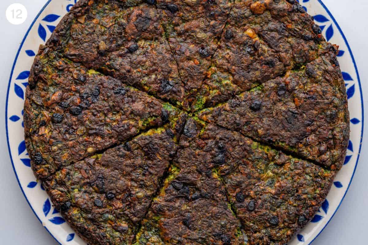 Kuku Sabzi Persian Herb Frittata on a plate cooled and sliced