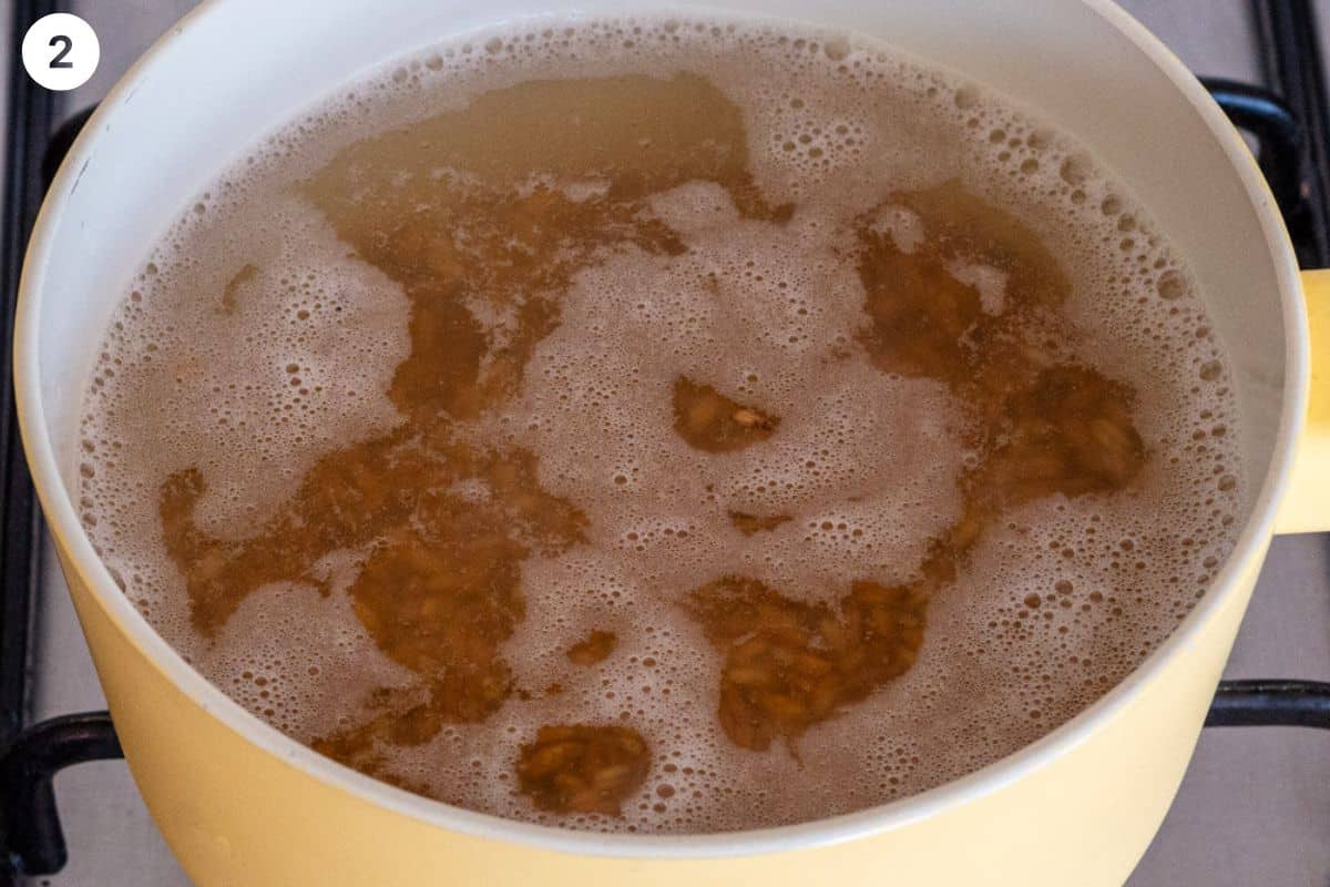 Farro being cooked in water in a pot