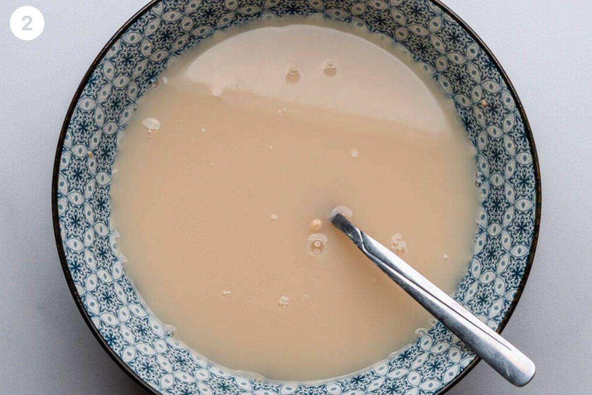 Yeast and water mixed in a small bowl