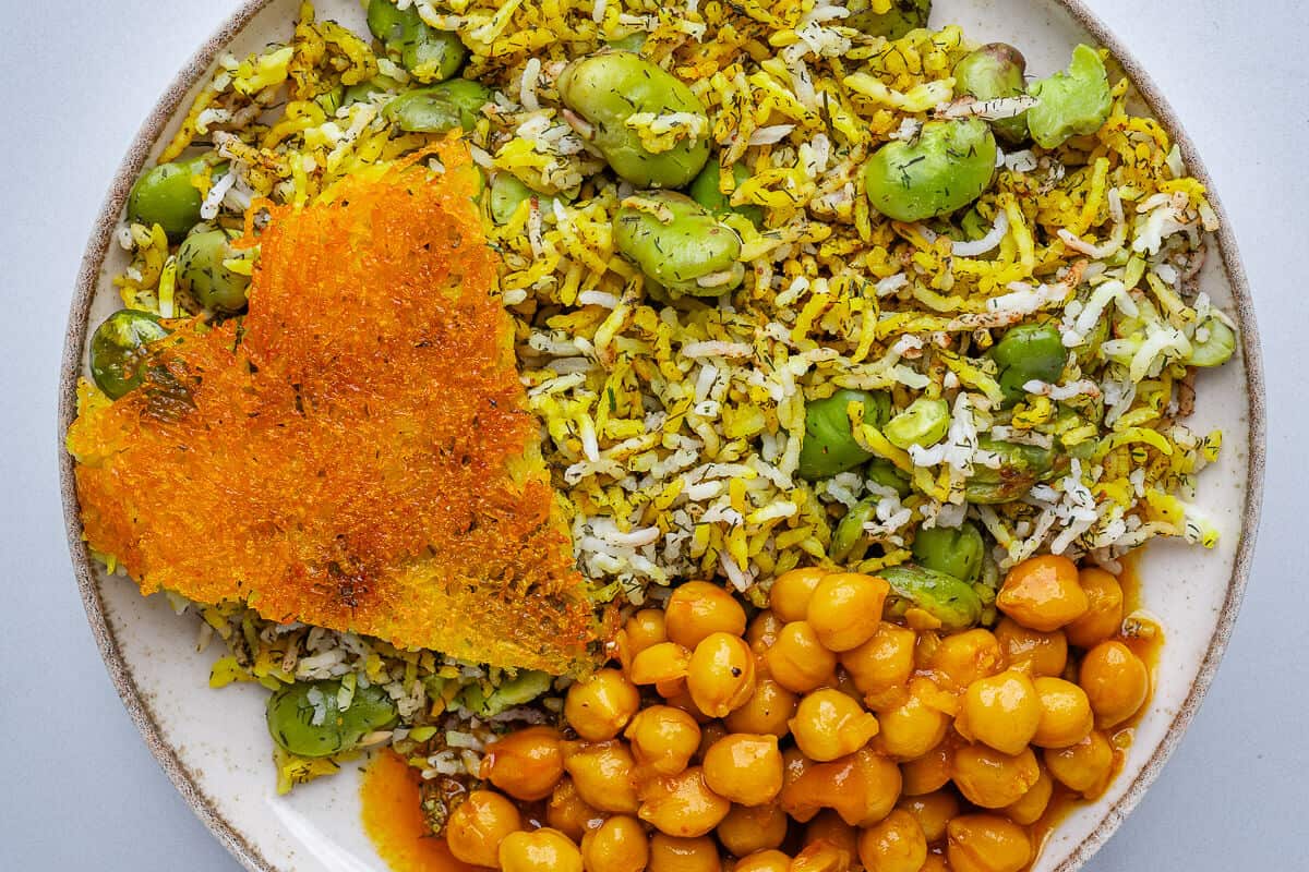 Plate served with Baghali Polo, a piece of tahdig and chickpea stew