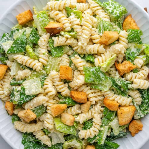 Caesar pasta salad in a bowl with croutons