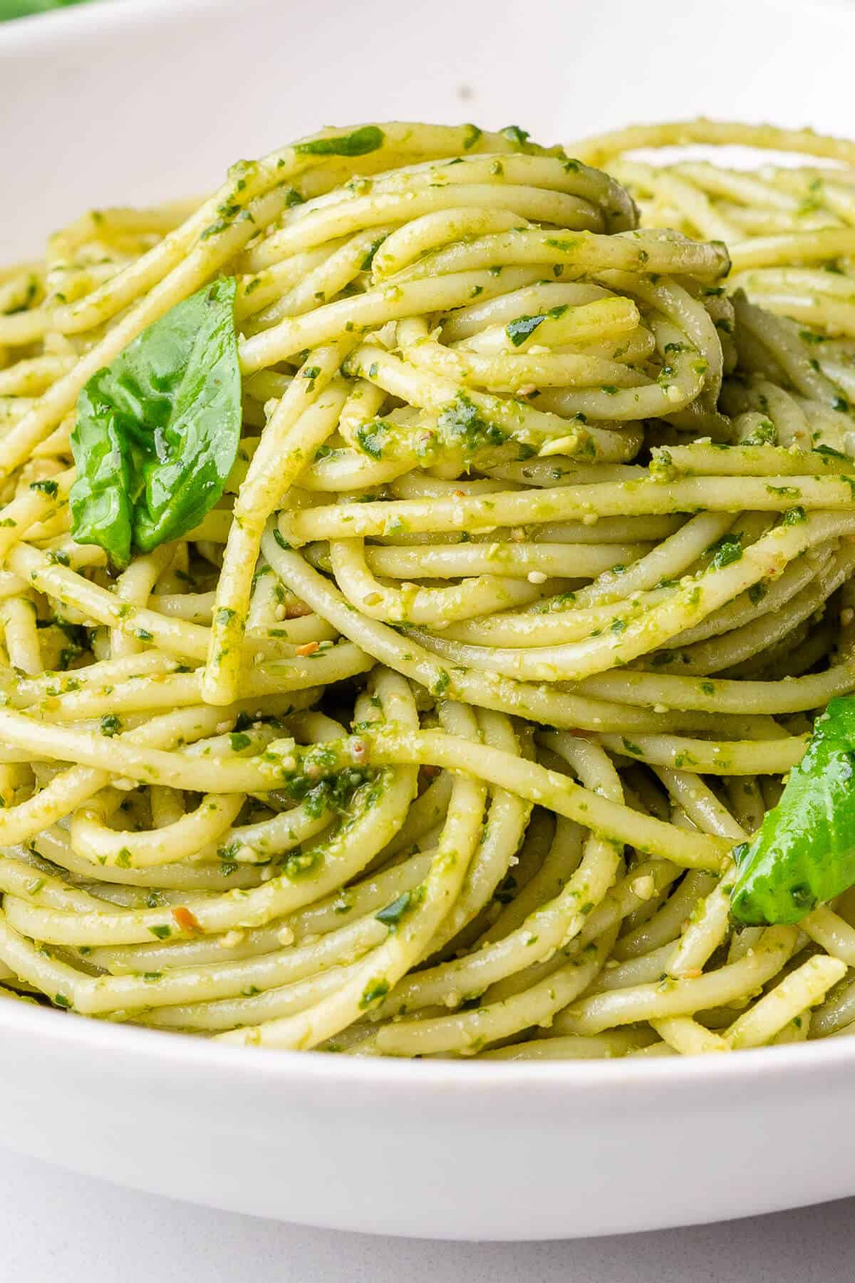 Bowl of pesto pasta with basil