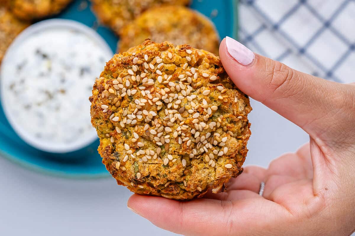 Fritter being held close up to show texture