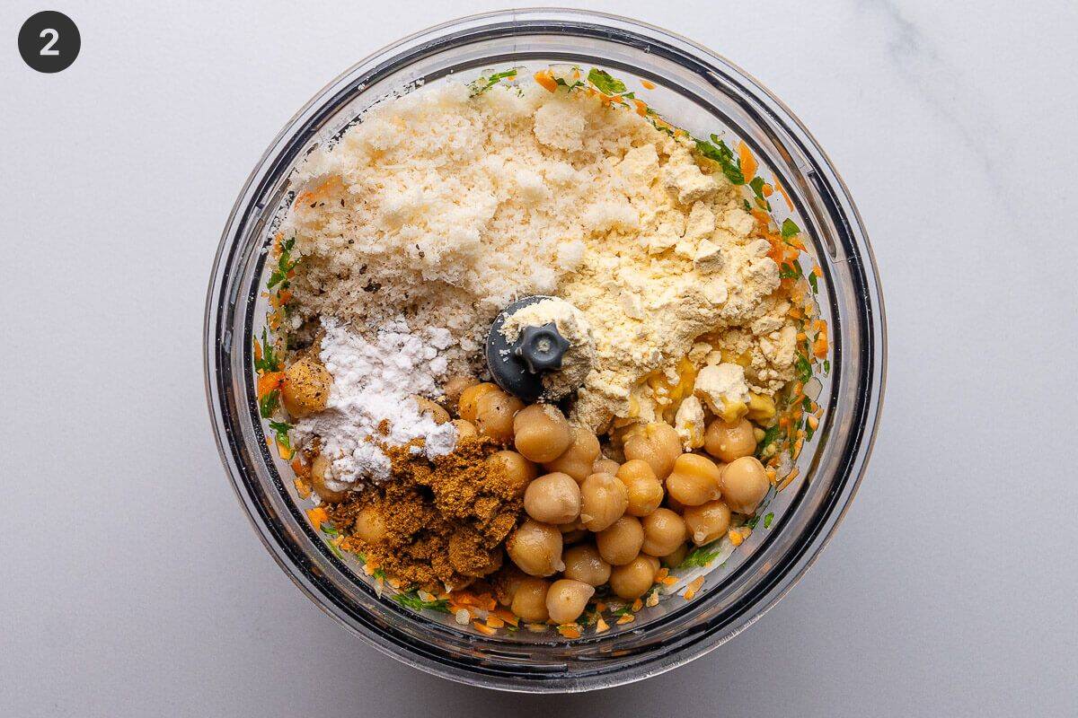 Chickpeas, chickpea flour, baking powder and cumin added to blender