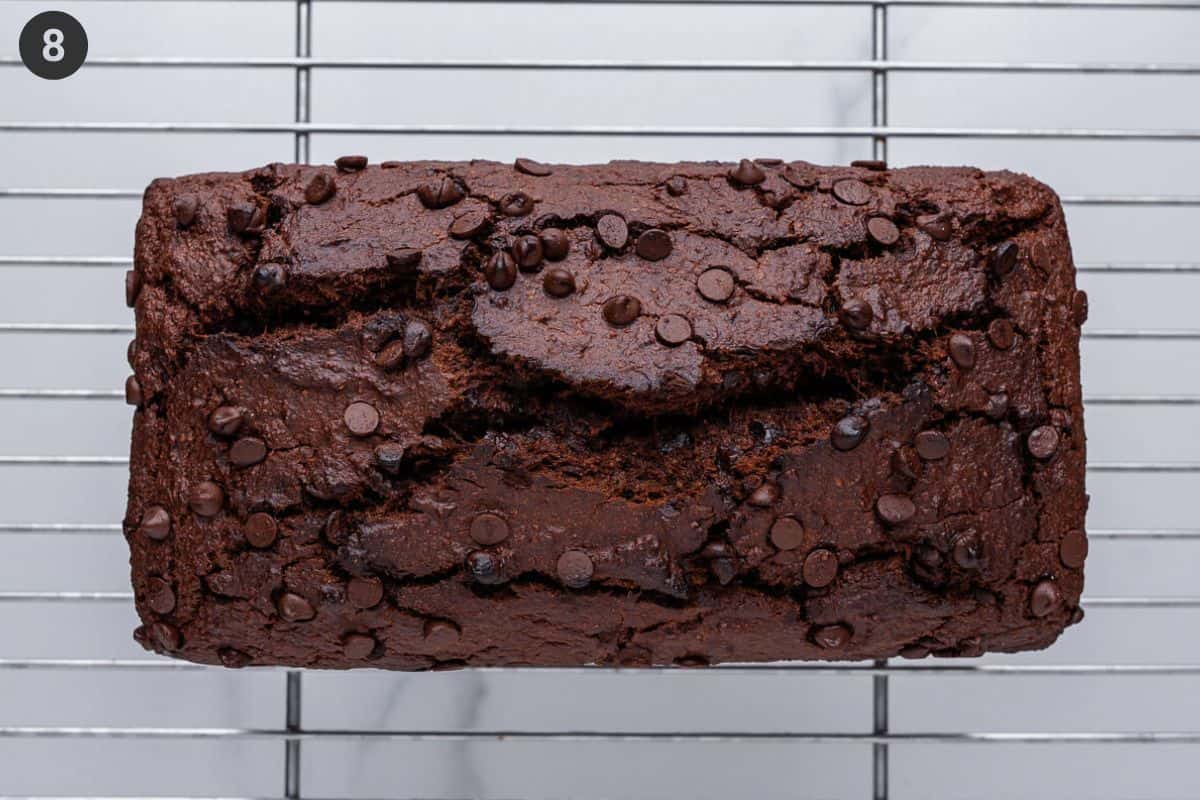 Bread loaf resting on a wire rack