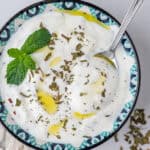 Greek Yogurt Sauce with mint and spoon in a bowl